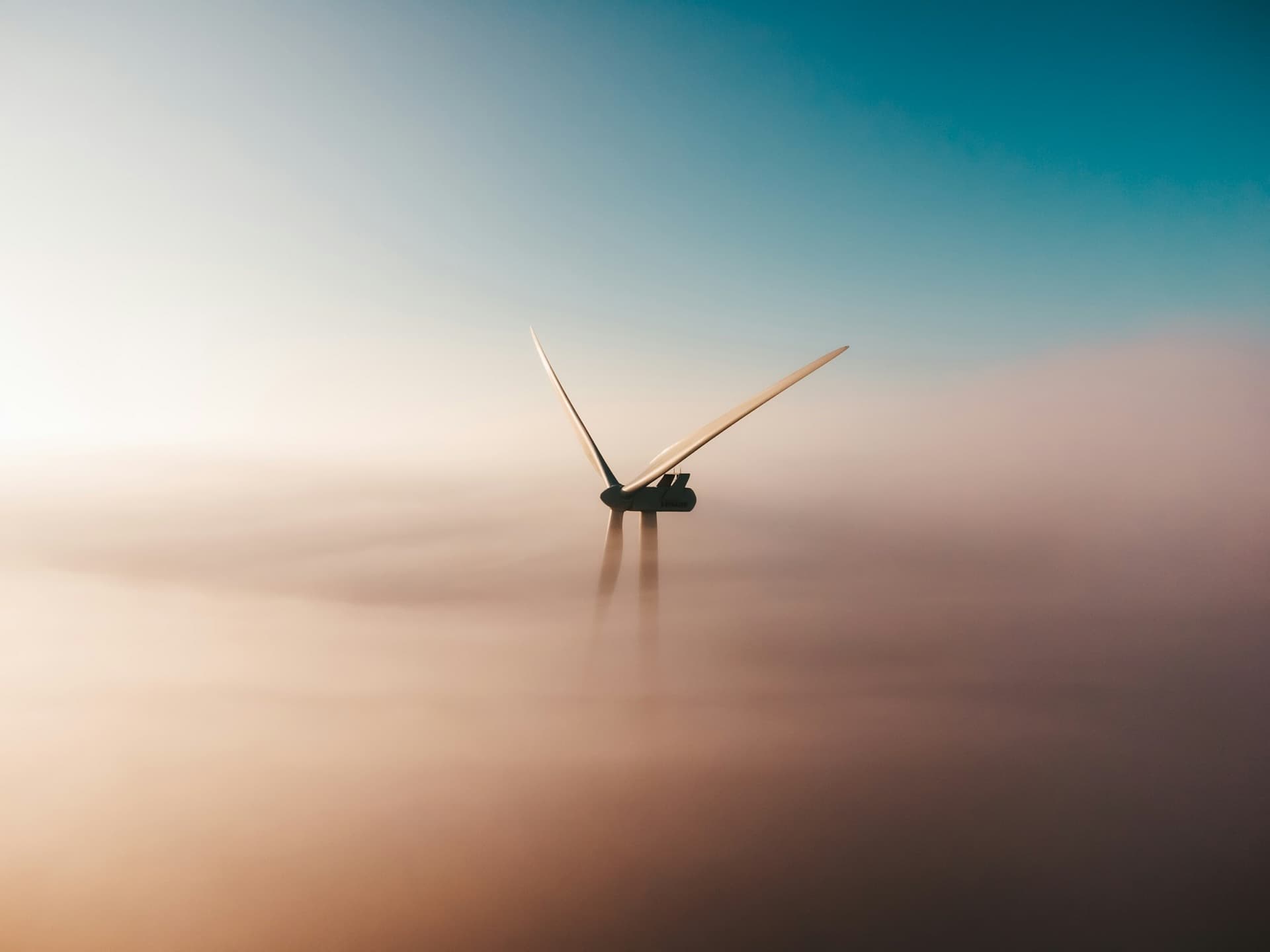 Wind turbines against an overcast sky